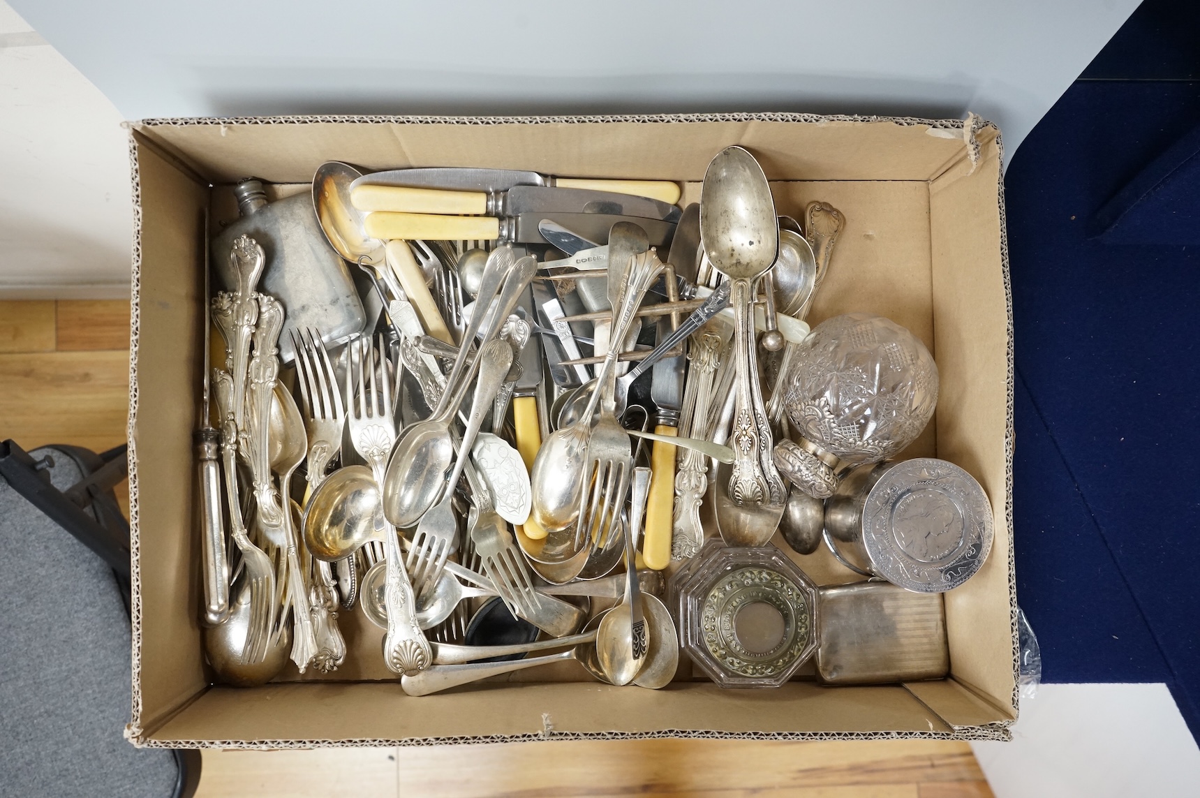 A pair of Victorian silver King's pattern table spoons by George Adams, London, 1858, a silver teaspoon, a mounted glass scent bottle, a silver cigarette case, a continental canister with inset coin lid, and assorted pla